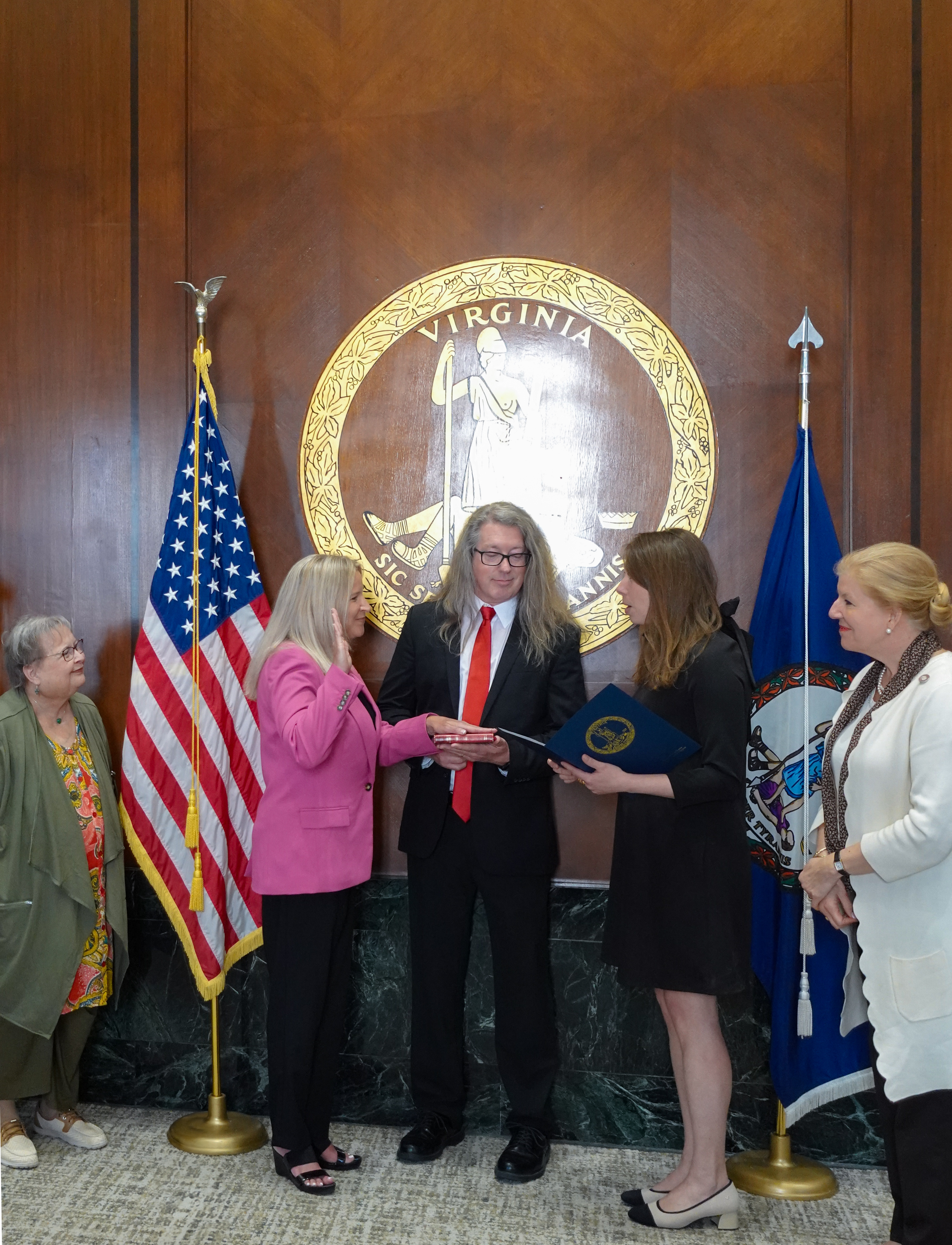 Dr. Beth Ackerman taking oath with her family