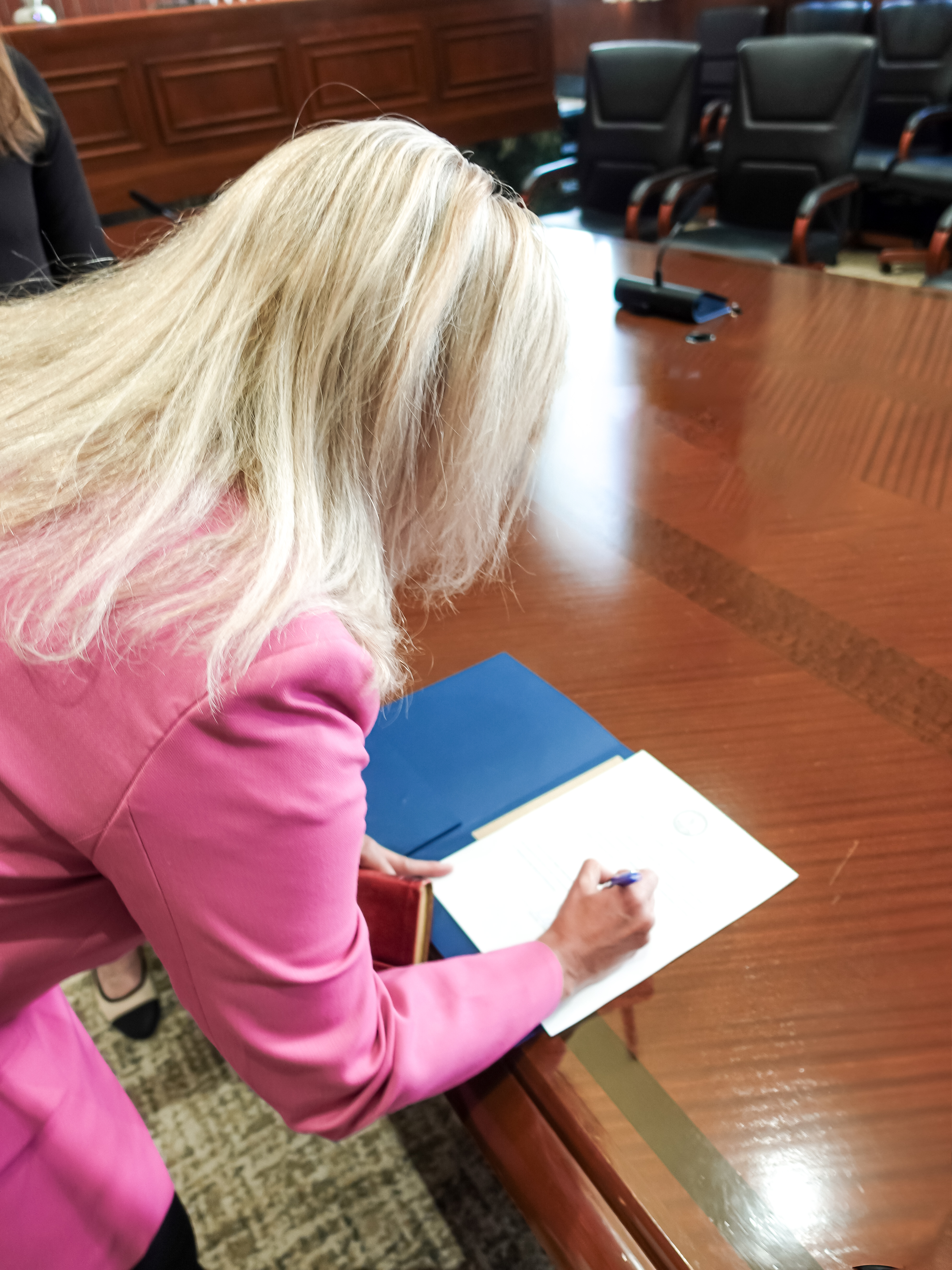 Dr. Beth Ackerman taking oath with her family
